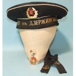 A Russian Navy hat with named cap tally and an enamelled medallion, (2).