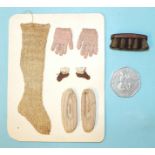 A collection of early-19th century miniature clothing knitted by a Mrs Coward of Roundway,