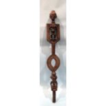 A Bamana carved wood staff with incised line decoration and two female standing figures, one above
