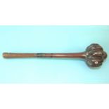 A Fijian hardwood throwing club ula, the lobed head inset with bore rings, the carved handle with
