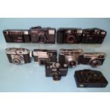 Ten various SLR cameras: Rollei 35 LED, Olympus Trip 35, Canon Sureshot (x2), Konica C35, Minolta