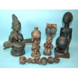 A small African carved wood double-female fertility figure, dark patina, with traces of pigment,