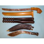 Two lignum vitae truncheons with turned handles, 38cm and 39cm, a kukri knife with two daggers to