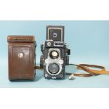A Yashica 44LM TLR camera no.2040515, with Yashinon 1:3.5/60 lenses, in leather case.