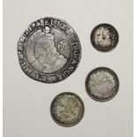 An Elizabeth I 1583 hammered-silver sixpence, (holed), two George V 1922 Maundy two-pence and one
