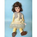 An Armand Marseille 390 bisque head doll with sleeping brown eyes, replaced wig, on jointed