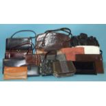 A collection of sixteen handbags and purses, including two crocodile bags.