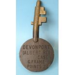 An Annetts bronze key stamped Devonport (Albert Rd) East, G. Frame, Points 2 on one side, 14cm long.