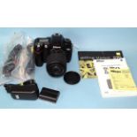 A Nikon D70 DSLR camera, with AF-S Nikkor 55-200mm f4-5.6 GED lens, battery (plus spare), charger,