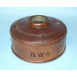 A stoneware Great Western Railway inkstand, incised GWR, (chip to base), 12cm diameter.