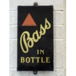 An original slate-backed glass pub advertising sign for 'Bass in Bottle', with gilded window