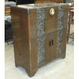 A 20th century Chinese camphor wood tallboy carved with bands of flora and foliage decoration, the
