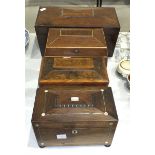 A 19th century mahogany sarcophagus-shaped tea caddy with fitted aperture for mixing bowl, flanked