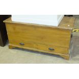 A grained pine blanket chest with two drawers beneath, 120cm wide, 60cm high.