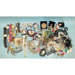 A quantity of costume jewellery and watches.