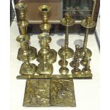 A collection of six pairs of brass candlesticks, tallest 25cm, shortest 7cm, a brass letter rack and