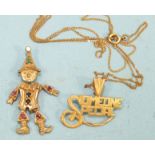 A 9ct gold gem-set articulated clown pendant and a 9ct gold "Someone Special" pendant on fine chain,