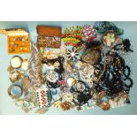 A quantity of vintage brooches, necklaces, earrings and other costume jewellery.