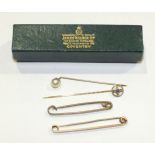 An Edwardian stick pin set a sapphire in 9ct gold mount, 0.9g, a 9ct gold tie pin, 2.4g (gross)