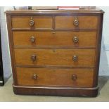 A late-Victorian mahogany straight-front chest of two short and three long cockbeaded drawers, on