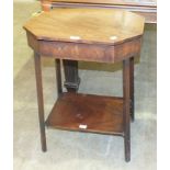 A Georgian mahogany octagonal-top work table with hinged lid.