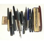 A Burnham fountain pen, (pocket clip lacking), a matching propelling pencil, a Parker fountain pen