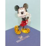 A Swarovski coloured crystal Disney figure of Mickey Mouse, standing sideways with both arms towards