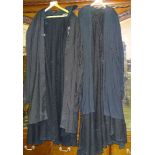 Various ecclesiastical robes and cloaks, including a black biretta with pompom.