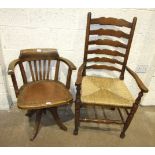 An oak revolving office armchair with padded seat and a set of six stained wood ladder-back dining