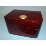 An Omega wooden box for a gentleman's wrist watch, 14cm wide, 8.5cm high, 12cm deep.