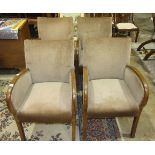 A set of four 1950's stained wood frame low chairs with upholstered seat and back, (4).