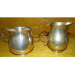 A plain silver baluster two-handled sugar bowl, 8cm high, Chester 1935 and a similar cream jug, 10cm