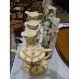 A graduated set of three Crown Devon 'Etria' decorated jugs, a similarly-decorated teapot and oval