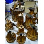 A set of five unmarked copper graduated measuring jugs, tallest 26cm, smallest 13cm, a copper