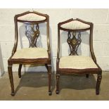 Two Edwardian inlaid mahogany nursing chairs.
