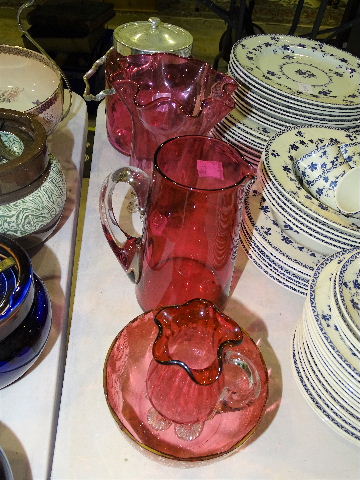 A cranberry glass biscuit barrel with plated mount, lid and handle, 27cm high overall, a cranberry