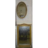 A modern pine shaped wall mirror, 117 x 74.5cm wide and a gilt-framed oval mirror, 80 x 61.5cm, (2).