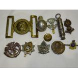 A Gibraltar brass military belt buckle, a Queen's Regiment silver and enamel sweetheart brooch, five