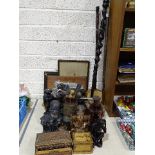 A collection of wooden items, including a tribal carved walking stick, figures and miscellaneous