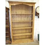 A set of modern pine free-standing bookshelves, 121cm wide, 198cm high, 32cm deep.