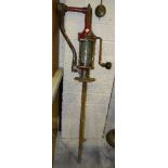 A vintage cast iron garage oil pump, 127cm high.