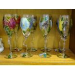 Eight hand-made limited-edition wine glasses by Elizabeth De Lisle, with floral decoration in