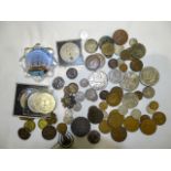 A George V 1935 crown, an Irish 1928-florin, other coinage, badges, etc.