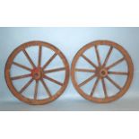A pair of vintage wooden and metal-rimmed cartwheels, 108.5cm diameter.