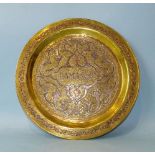 A Damascus 'Cairo ware' circular brass plate with white metal and copper inlaid decoration, 29cm