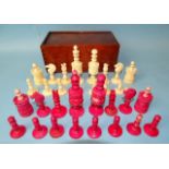 A late-19th century carved  and stained bone chess set, one white pawn missing, small damages, in