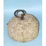 A granite animal tethering stone, the iron tether ring fixed to the bun-shaped granite base,