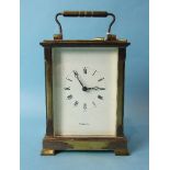 A 20th century brass carriage clock, the movement marked Made in France, striking on a gong, the