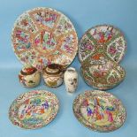 A large 19th century Chinese Canton porcelain dish, 34.5cm diameter, a pair of similar plates and