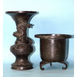 A 19th century Japanese bronze tripod censer and a bronze vase of baluster form with an applied